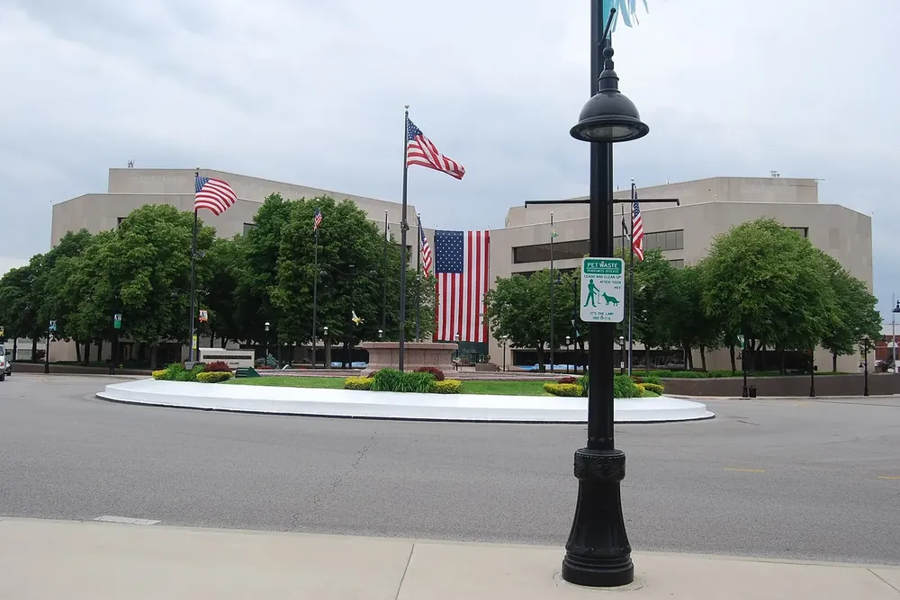 Flags over a landscaped circle in front of the St. Clair County Courthouse in Belleville, Illinois