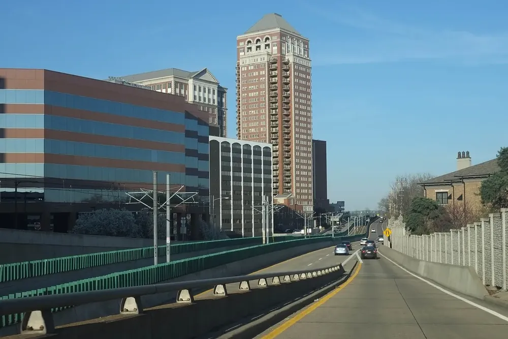 Forest Park Parkway curving toward the brick high-rises of downtown Clayton, Missouri