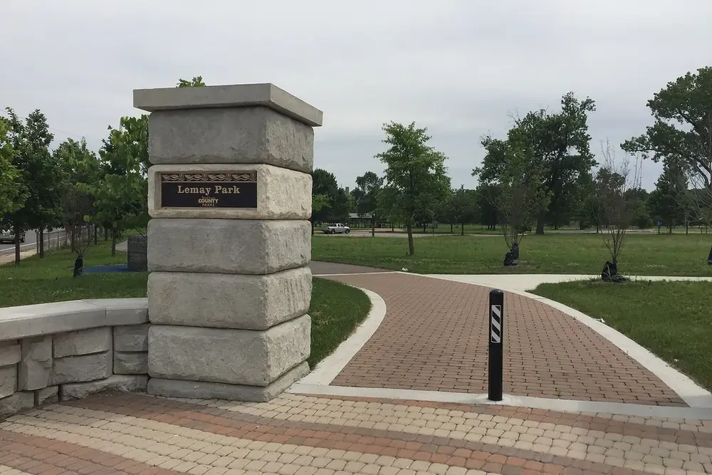 Stone entrance pillar and brick path at Lemay Park in Lemay, Missouri